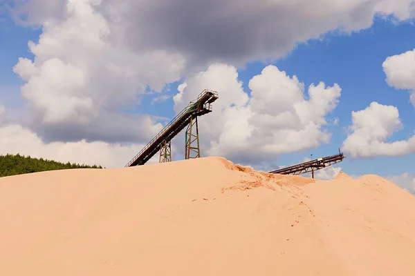 Conveyor belts and sand heaps. Construction industry. Sand quarry. Horizontal  photo
