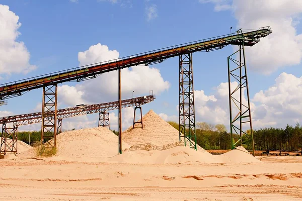 Conveyor belts and sand heaps. Construction industry. Sand quarry. Horizontal  photo