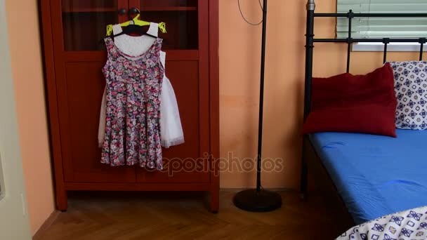 Girls bedroom. Hats in wardrobe. The dresses on the wardrobe — Stock Video