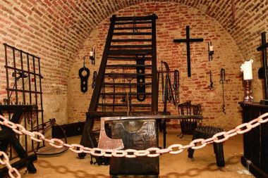 Inquisition torture chamber. Old medieval torture chamber with many pain tools. clipart