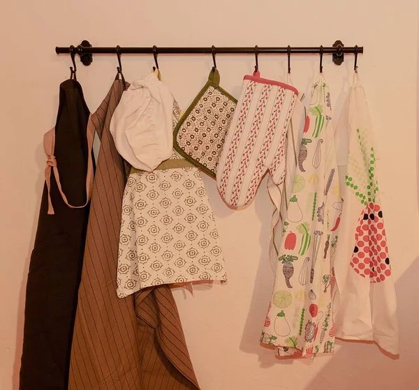 Dish towels, oven glove, oven mitts and bib aprons for adult even children.