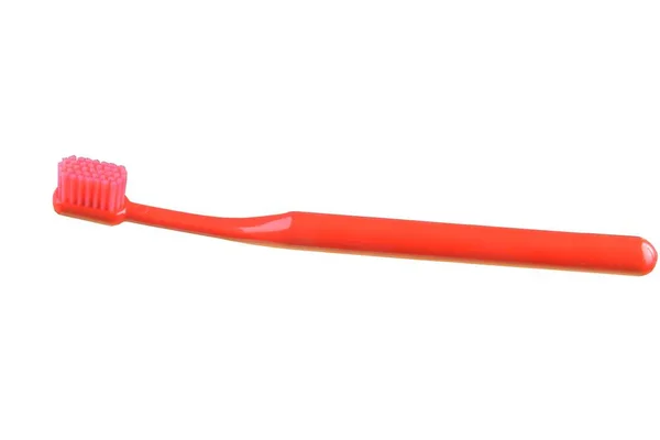 Κόκκινο οδοντόβουρτσα που απομονώνονται σε λευκό φόντο. — Φωτογραφία Αρχείου
