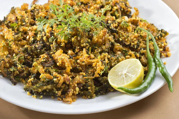 Indian Dish: Bitter gourd fry with spices and herbs — Stock Photo, Image