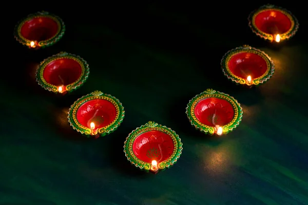 Happy Diwali - Clay Diya lamps lit during Diwali celebration. Greetings Card Design of Indian Hindu Light Festival called Diwali — Stock Photo, Image