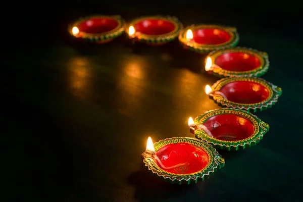 Happy Diwali - Clay Diya lamps lit during Diwali celebration. Greetings Card Design of Indian Hindu Light Festival called Diwali — Stockfoto