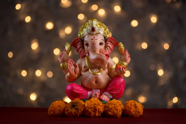 Hindu God Ganesha on Blured bokeh background, Ganesha Idol.