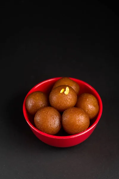 Gulab Jamun in bowl on black background. Indian Dessert or Sweet Dish. — Stock Photo, Image