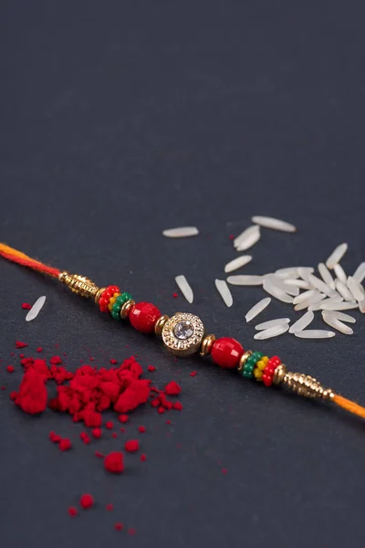 Raksha Bandhan Rakhi Rice Grains Kumkum Black Background Traditional Indian — Stock Photo, Image