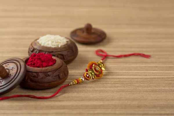 Indian Festival Raksha Bandhan Background Elegant Rakhi Rice Grains Kumkum — Stock Photo, Image