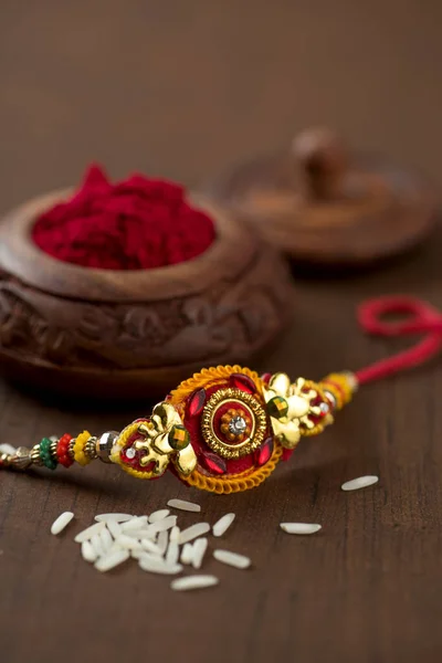 Festa Indiana Sfondo Raksha Bandhan Con Elegante Rakhi Rice Grains — Foto Stock