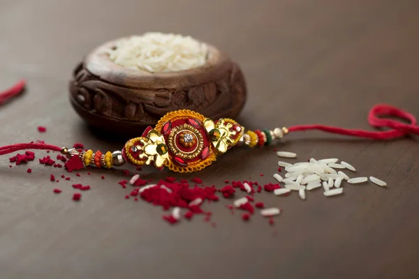 Festa Indiana Sfondo Raksha Bandhan Con Elegante Rakhi Rice Grains — Foto Stock