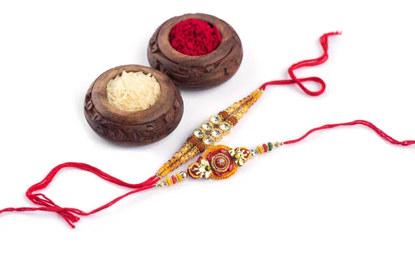 Sfondo Raksha Bandhan Con Elegante Rakhi Rice Grains Kumkum Sfondo — Foto Stock