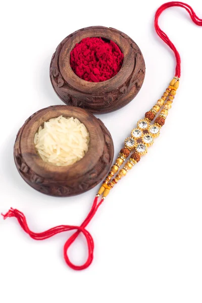 Raksha Bandhan Background Elegant Rakhi Rice Grains Kumkum White Background — Stockfoto