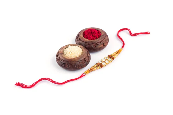 Raksha Bandhan Background Elegant Rakhi Rice Grains Kumkum White Background — Stockfoto