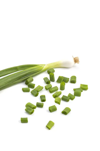 Fresh ripe green spring onions (shallots or scallions) with fresh chopped green onions on white background — Stock Photo, Image