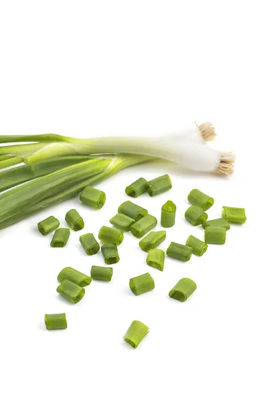 Fresh ripe green spring onions (shallots or scallions) with fresh chopped green onions on white background — Stock Photo, Image