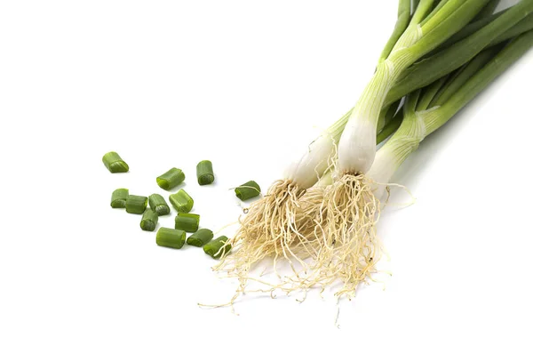 Fresh ripe green spring onions (shallots or scallions) with fresh chopped green onions on white background — Stock Photo, Image