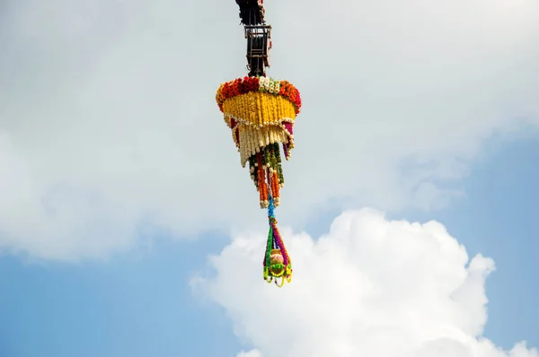 Dahi Handi background on Gokul Ashtami festival with hanging pot filling with curd with flower decoration. — Stock Photo, Image