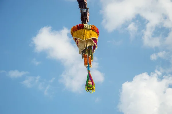 Dahi Handi background on Gokul Ashtami festival with hanging pot filling with curd with flower decoration. — Stock Photo, Image