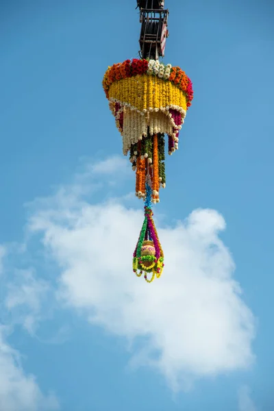 Dahi Handi background on Gokul Ashtami festival with hanging pot filling with curd with flower decoration. — Stock Photo, Image