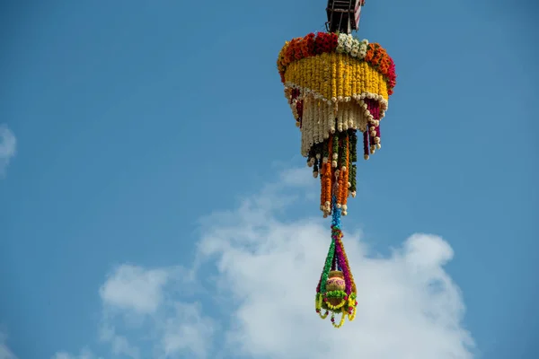 Dahi Handi background on Gokul Ashtami festival with hanging pot filling with curd with flower decoration. — Stock Photo, Image