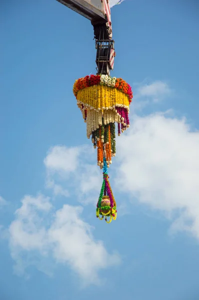 Dahi Handi background on Gokul Ashtami festival with hanging pot filling with curd with flower decoration. — Stock Photo, Image