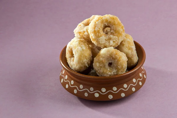 Indian Traditional Sweet Food Balushahi on a pink background
