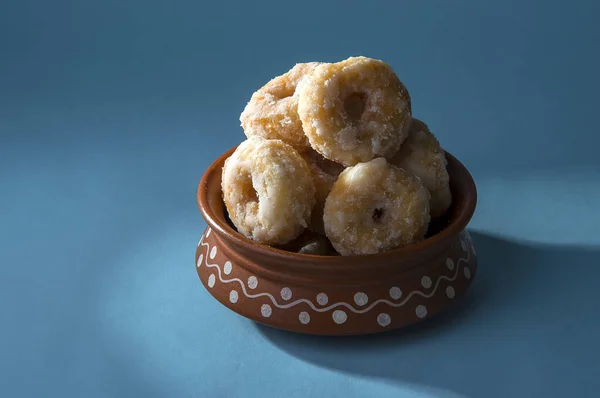 Indian Traditional Sweet Food Balushahi on a blue background