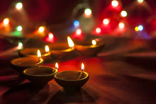 Clay diya lamps lit during Diwali Celebration. Greetings Card Design Indian Hindu Light Festival called Diwali — Stock Photo, Image