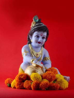 Kırmızı arka planda Hindu tanrısı Krishna