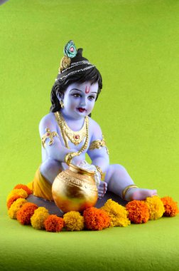Yeşil arka planda Hindu tanrısı Krishna
