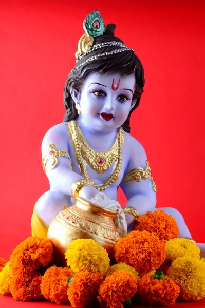 Hindu God Krishna on red background — ストック写真