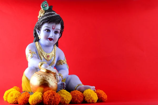 Kırmızı arka planda Hindu tanrısı Krishna — Stok fotoğraf