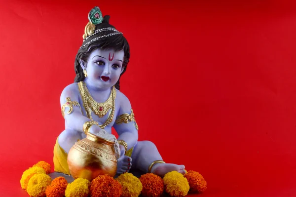 Hindoe God Krishna op rode achtergrond — Stockfoto