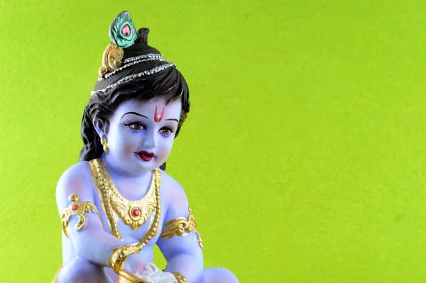 Hindu God Krishna on green background — Stock Photo, Image