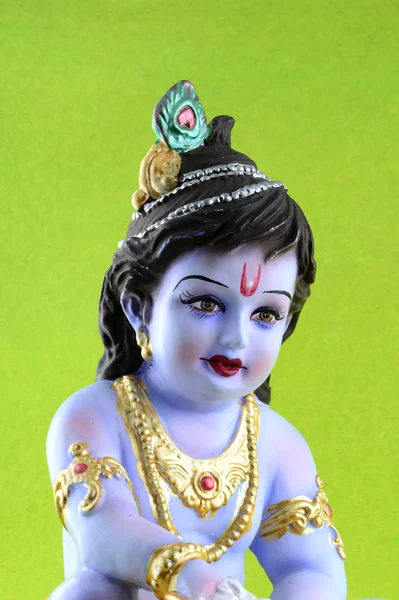 Yeşil arka planda Hindu tanrısı Krishna — Stok fotoğraf