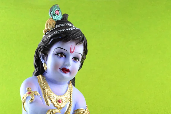 Hinduguden Krishna på grønn bakgrunn – stockfoto