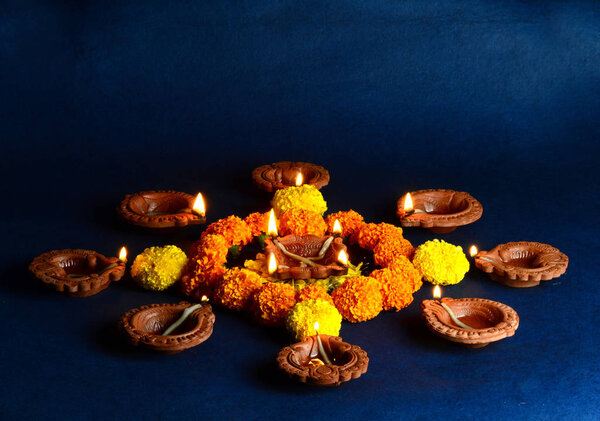 Clay diya lamps lit during diwali celebration. Greetings Card Design Indian Hindu Light Festival called Diwali