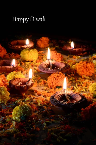 Clay diya lamps lit during Diwali Celebration. Greetings Card Design Indian Hindu Light Festival called Diwali — Stock Photo, Image