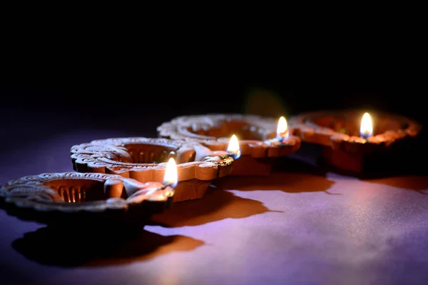 Colorful clay Diya (Lantern) lamps lit during Diwali celebration. Greetings Card Design Indian Hindu Light Festival called Diwali. — 스톡 사진