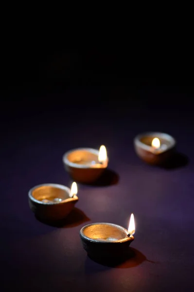 Colorful clay Diya (Lantern) lamps lit during Diwali celebration. Greetings Card Design Indian Hindu Light Festival called Diwali. — 스톡 사진