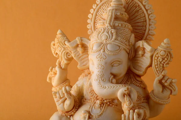 Hindu God Ganesha. Ganesha Idol on yellow background — Stock Photo, Image