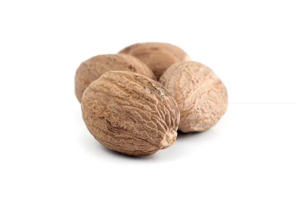 Nutmeg isolated on white background. Close up. — Stockfoto