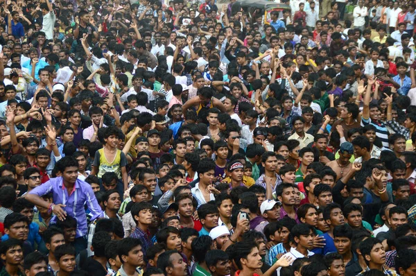 AMRAVATI, MAHARASHTRA, INDIA - AUGUST 24 : Crowd of young People enjoying "Govinda" at Dahi Handi festival to celebrate God Krishna's Birth in Amravati, Maharashtra, India. 24 August 2014 Stock Photo