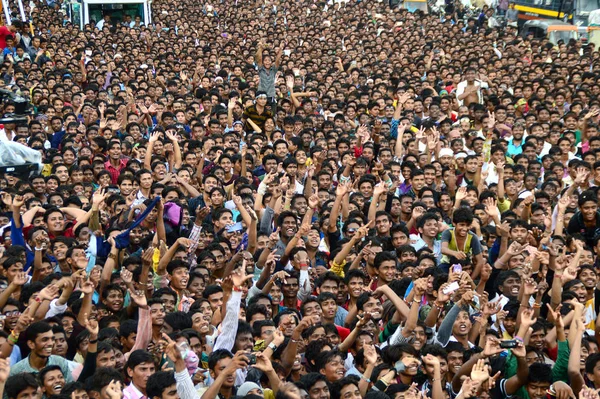 AMRAVATI, MAHARASHTRA, INDIA - AUGUST 24 : Crowd of young People enjoying "Govinda" at Dahi Handi festival to celebrate God Krishna's Birth in Amravati, Maharashtra, India. 24 August 2014 Royalty Free Stock Images