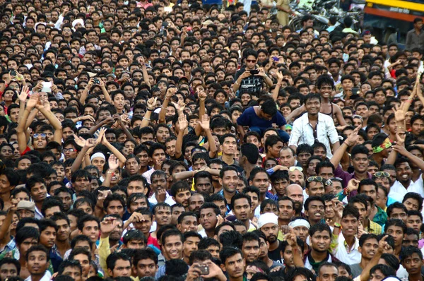 AMRAVATI, MAHARASHTRA, INDIA - AUGUST 24 : Crowd of young People enjoying "Govinda" at Dahi Handi festival to celebrate God Krishna's Birth in Amravati, Maharashtra, India. 24 August 2014 Royalty Free Stock Photos