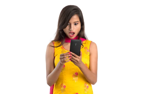 Young Indian Girl Using Mobile Phone Smartphone Isolated White Background — Stock Photo, Image