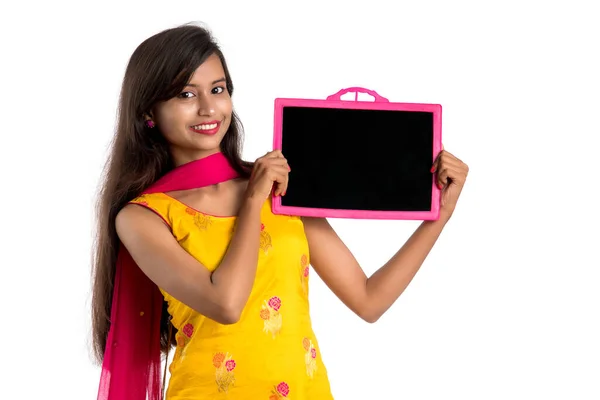 Beautiful Young Girl Holding Showing Something Chalkboard Slate Isolated White — Stock Photo, Image