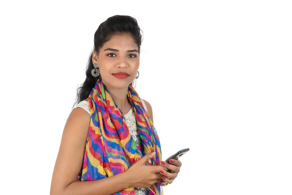 Young Indian Girl Using Mobile Phone Smartphone Isolated White Background — Stock Photo, Image