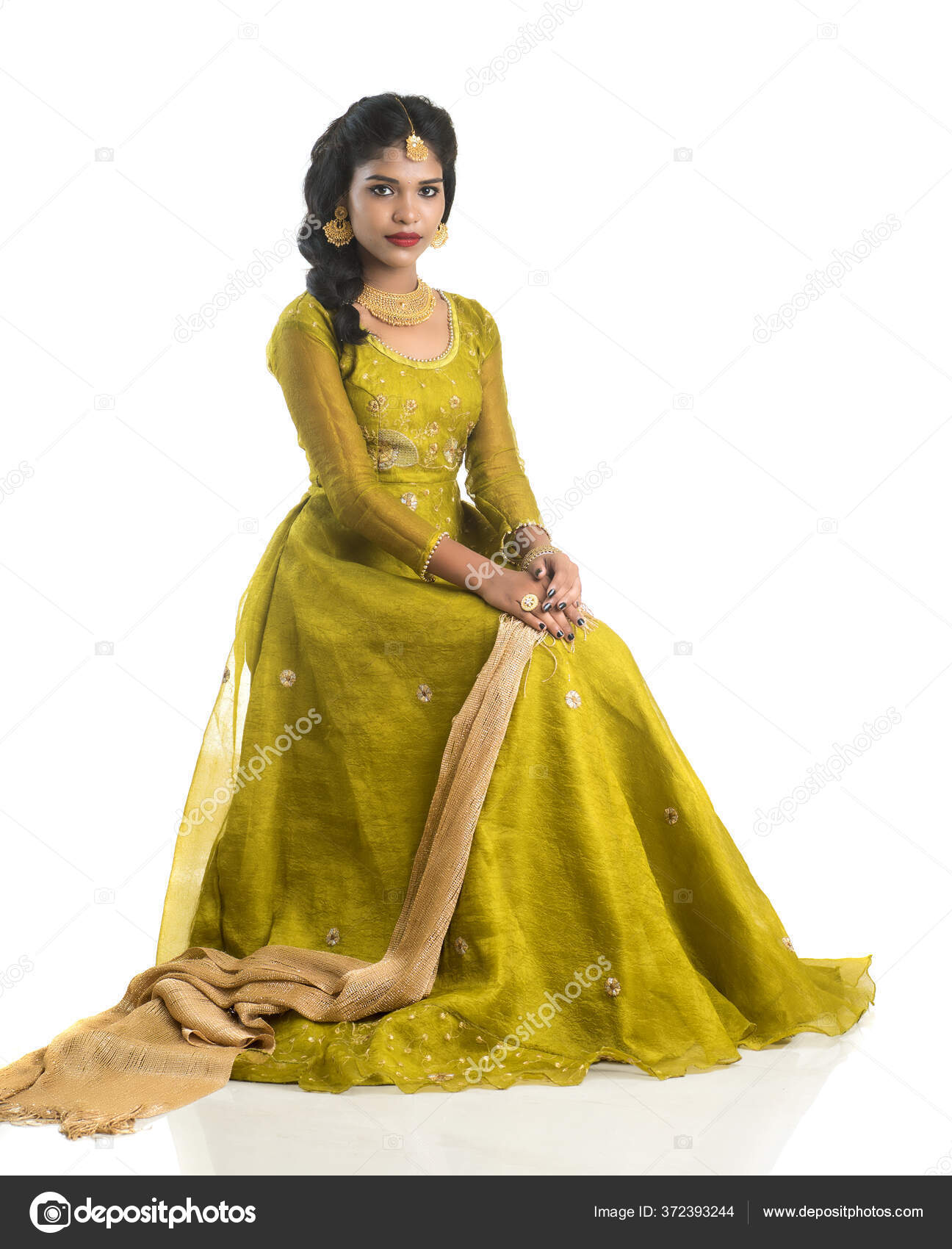 a woman in traditional indian clothing poses for a photo. AI-Generated  31961201 Stock Photo at Vecteezy